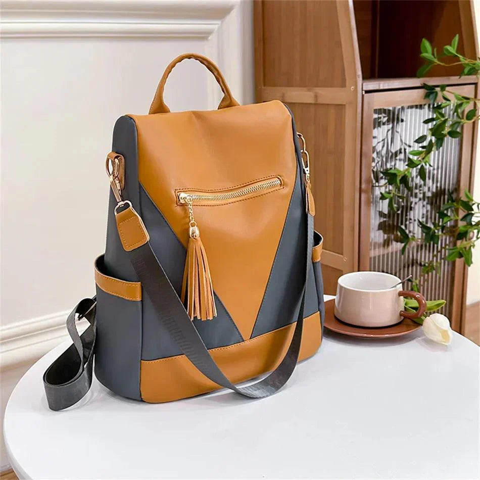 Backpack in two-colour look with tassel pendant